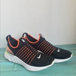 Nike ladies Black and Orange Slip-On Sneakers
